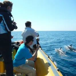 a couple of people that are standing in a body of water