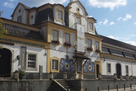a castle with a clock on the side of a building