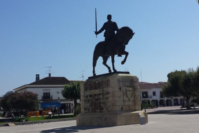 a man jumping in the air doing a trick on a skateboard