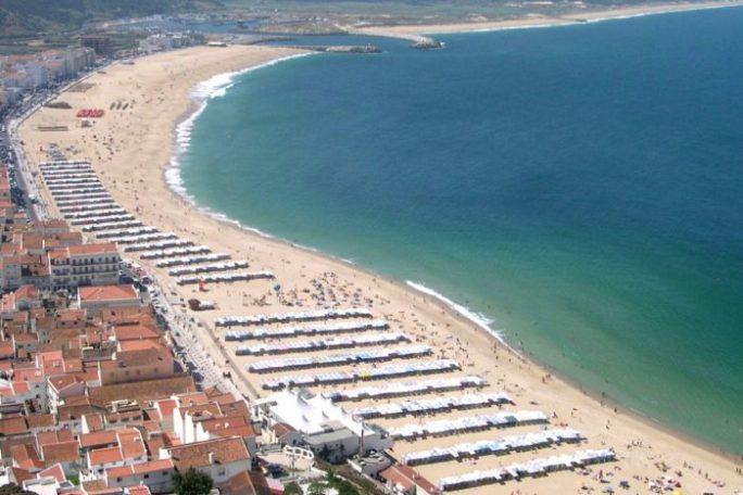 a view of a beach next to a body of water