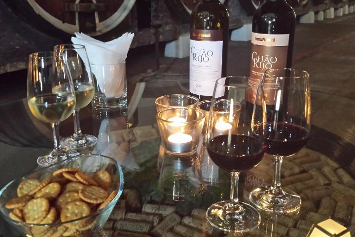 a table topped with glasses of wine