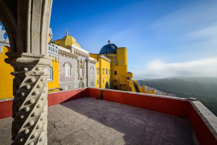 a yellow boat sitting on top of a stone building