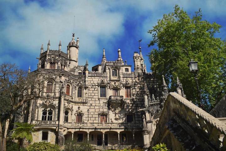 a large clock tower in front of a building