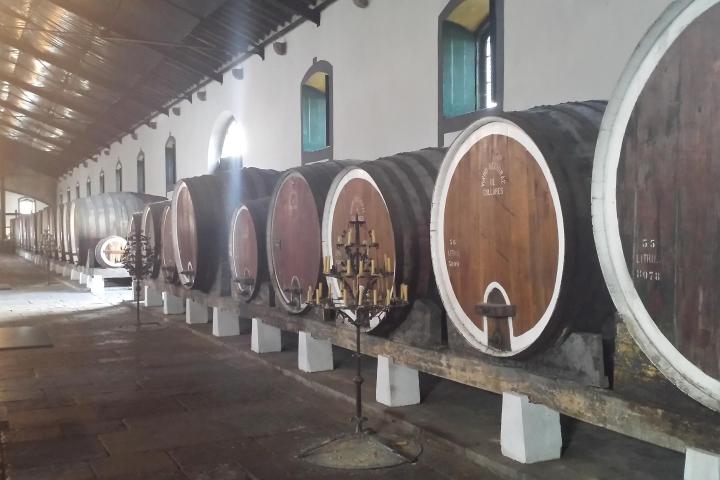 a barrel sitting next to a building
