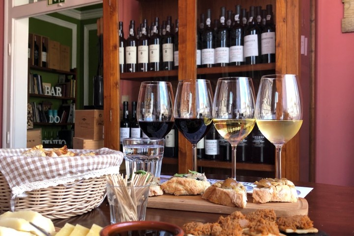 a kitchen with wooden cabinets and a dining table