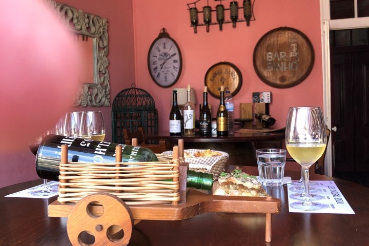 a vase sitting on top of a wooden table