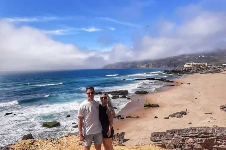 a man standing on top of a sandy beach