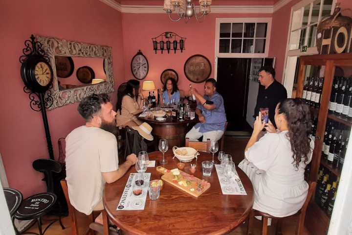 a group of people sitting at a table in a restaurant