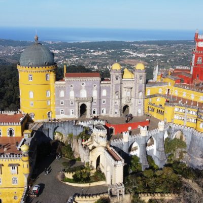 a group of people standing on top of Sintra