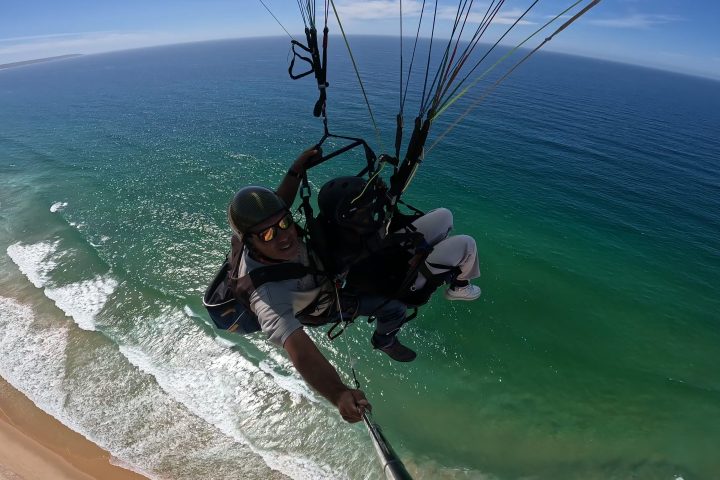 a man riding a wave on top of a body of water