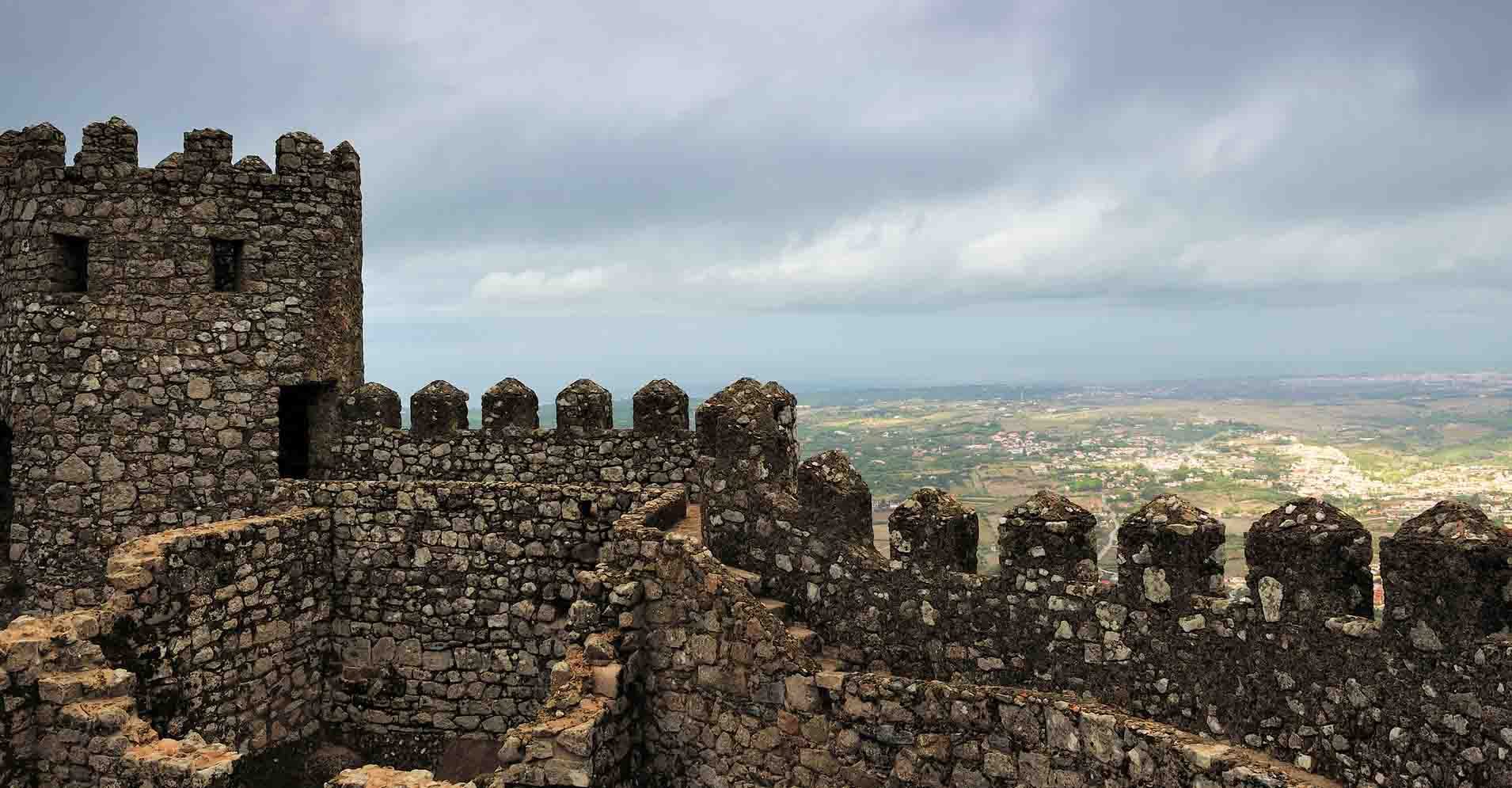 a castle on top of a rock wall