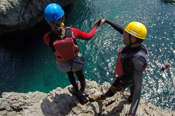 a little boy that is standing in the water