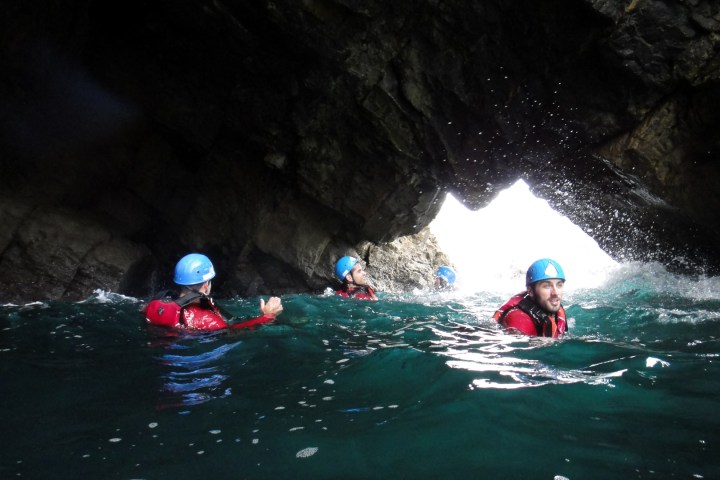 a girl riding a wave on a surfboard in the water