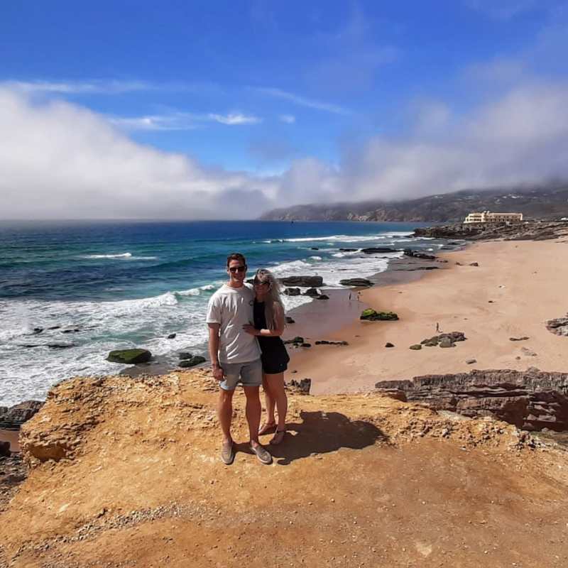 a man standing on top of a sandy beach