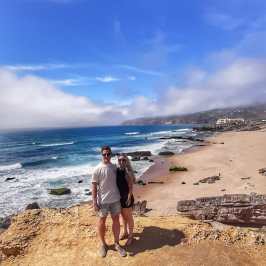 a man standing on top of a sandy beach
