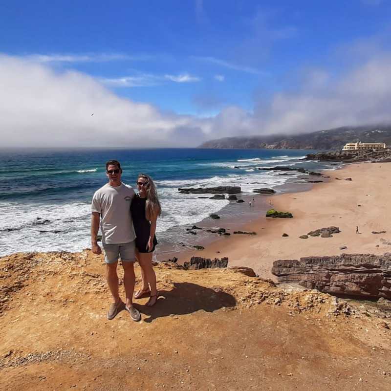 a man standing on top of a sandy beach