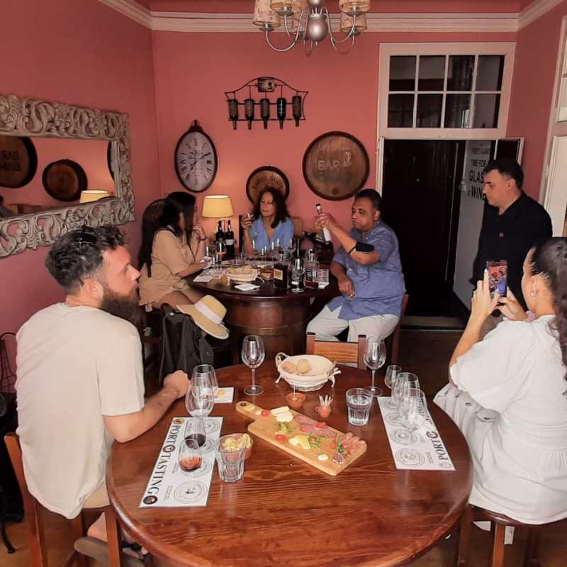 a group of people sitting at a table in a restaurant