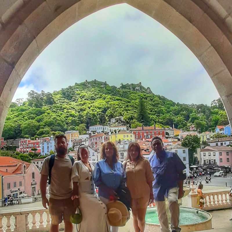 a group of people standing in front of a building