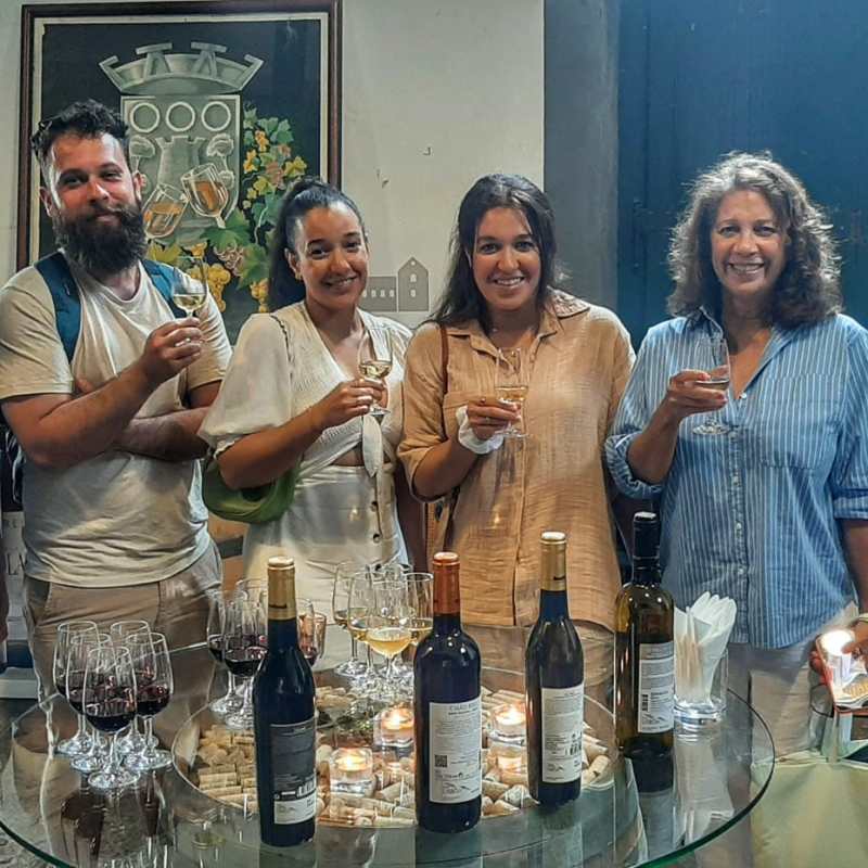 a group of people holding wine glasses