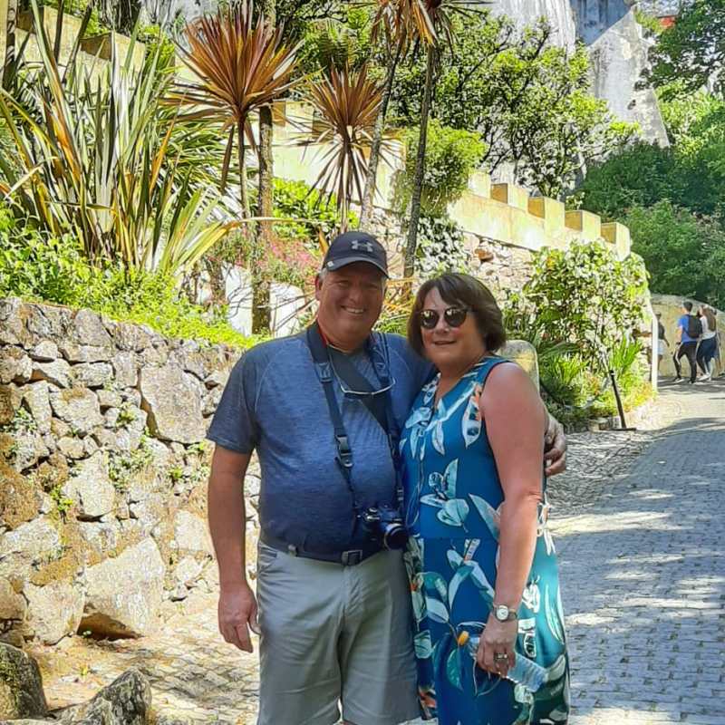 a man standing on a sidewalk