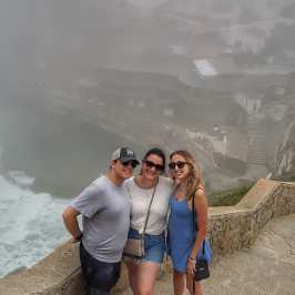 a man and a woman standing on a beach