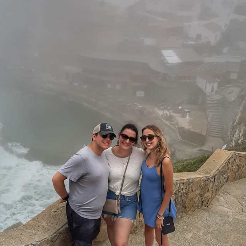a man and a woman standing on a beach