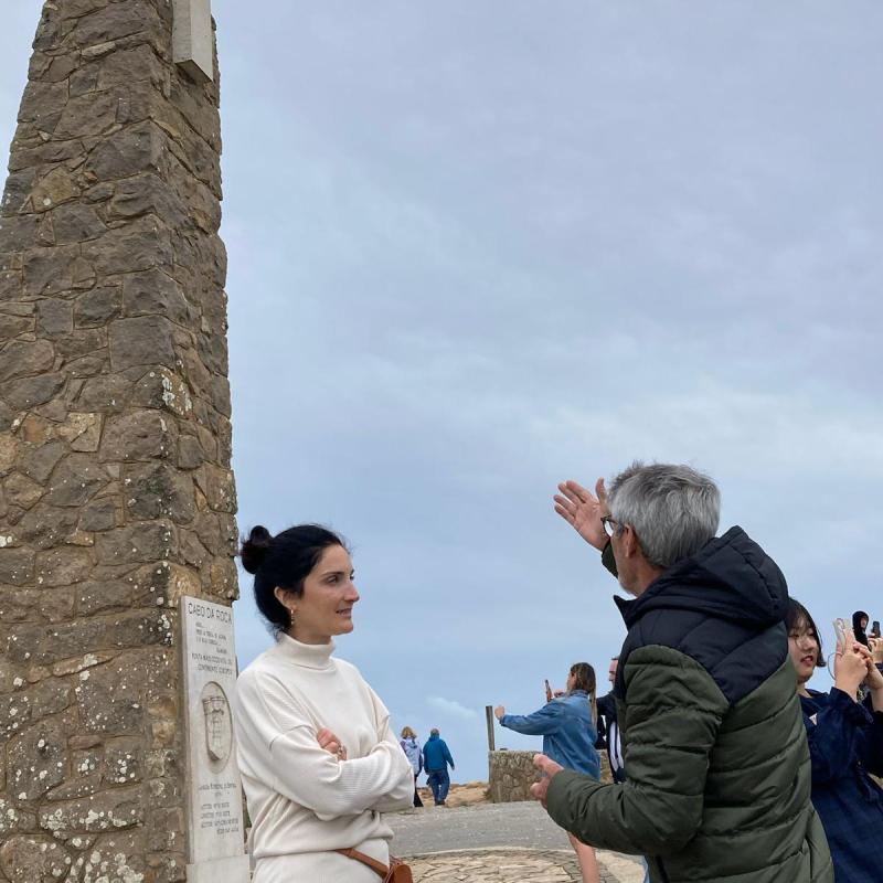 a group of people standing in front of a building
