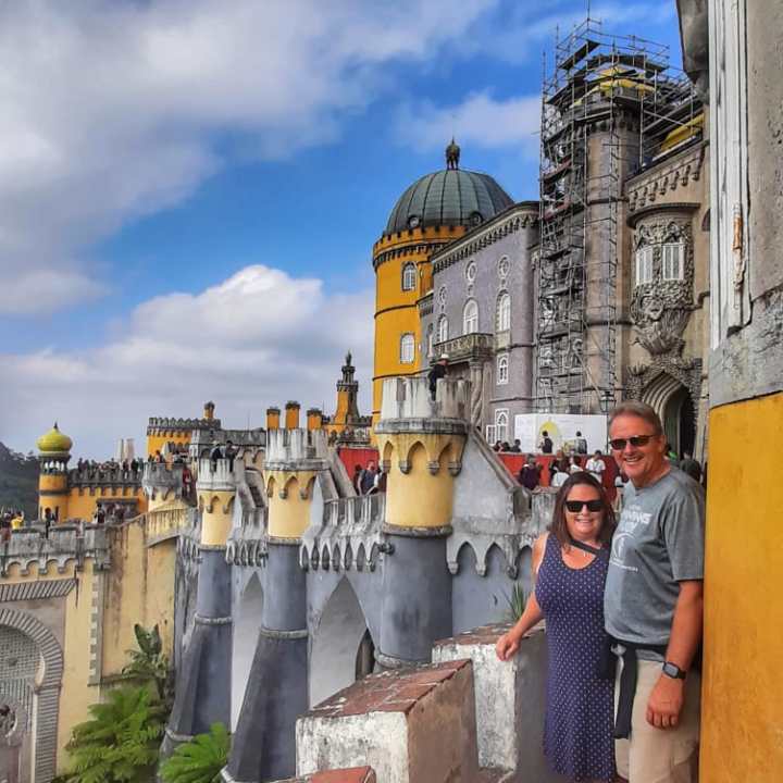a man standing in front of a building