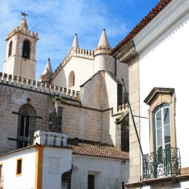 a church with a clock on the front of a building