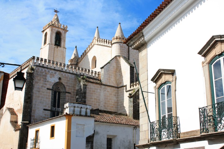 a church with a clock on the front of a building
