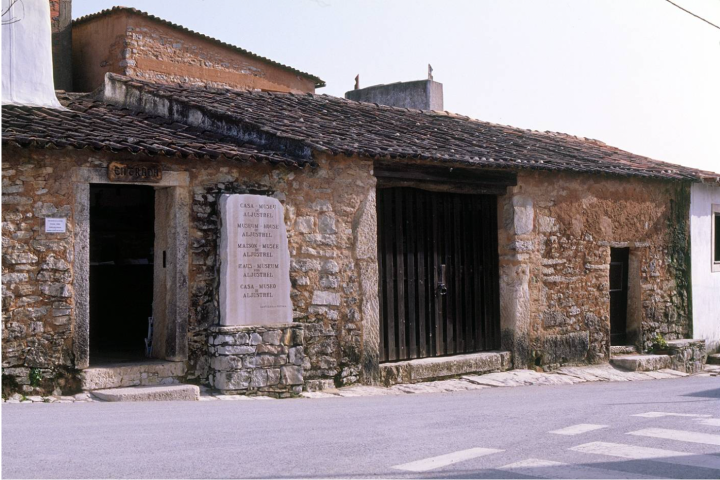 a close up of a street in front of a brick building