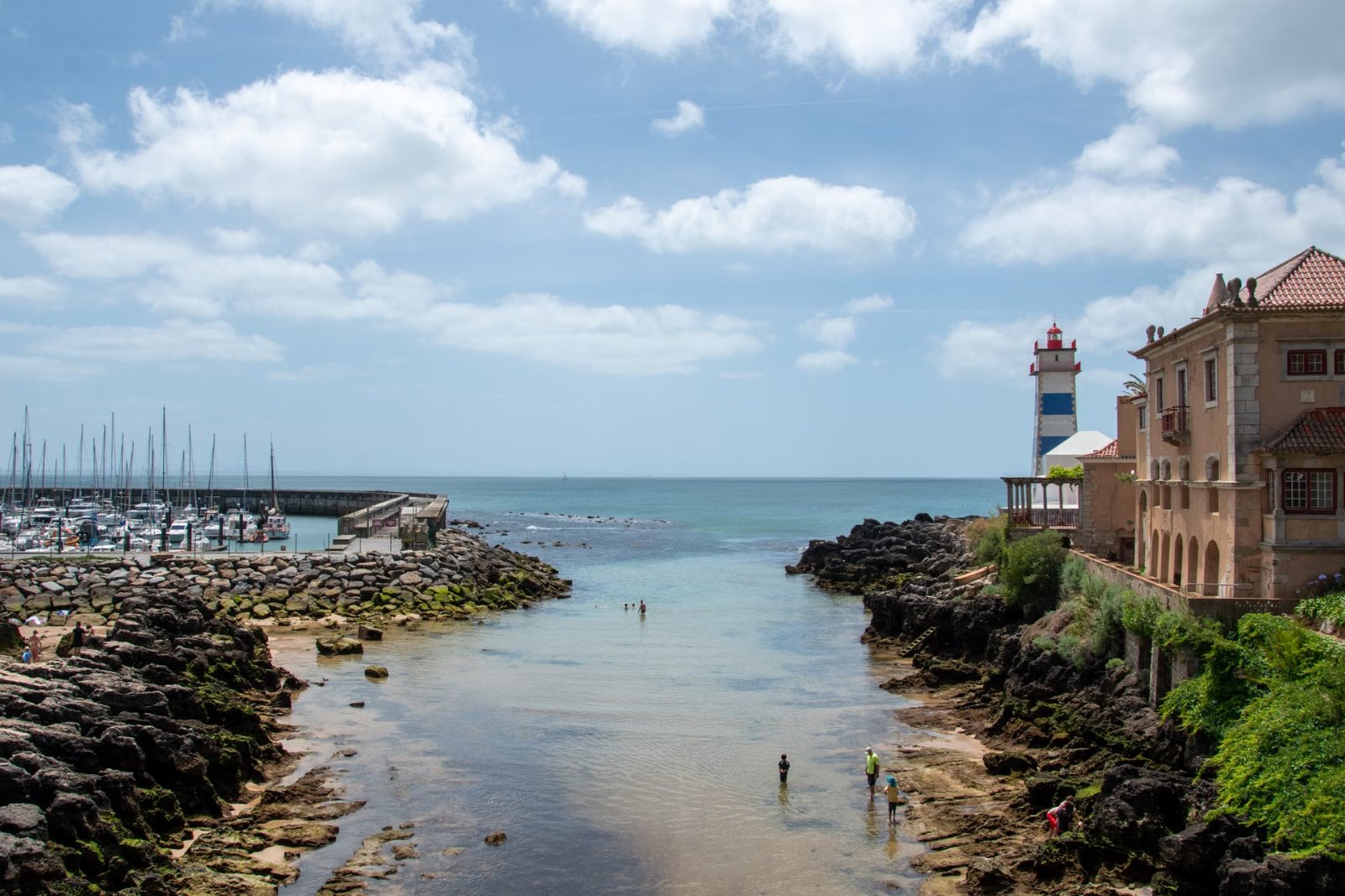 Cascais marina with the Santa Marta lighthouse on an Azenhas do Mar and Cascais day trip from Lisbon