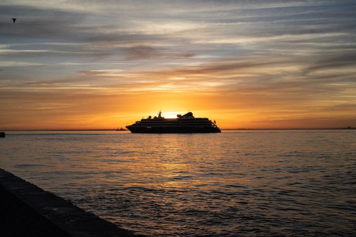 Cruise ship on the Tagus river in Lisbon at sunrise